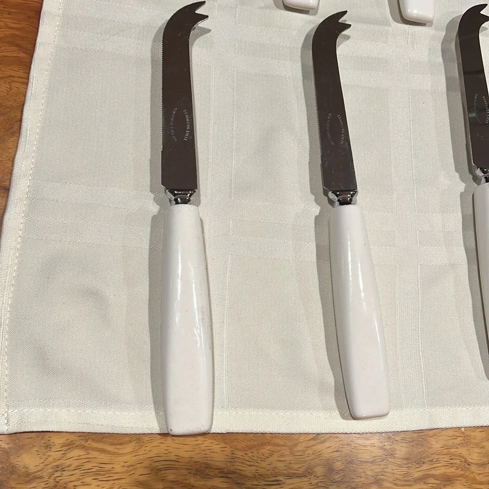 Set of 12 Sheffield England Curved Tip Knife Knives White Ceramic Handle